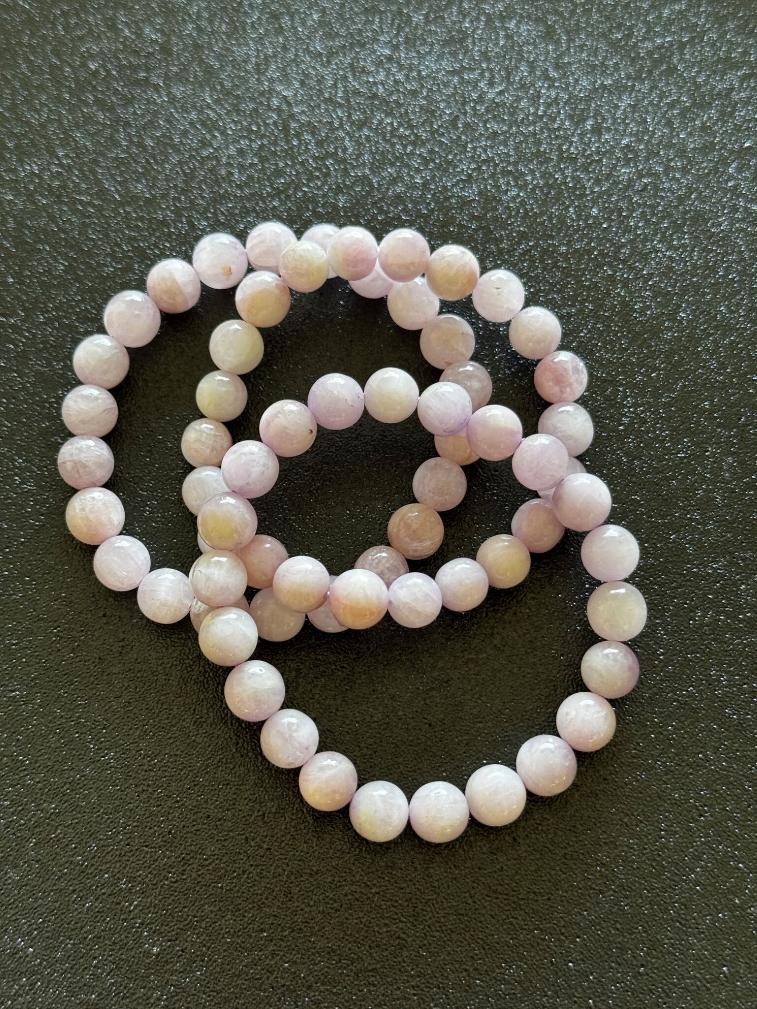 Soft pink kunzite crystal with a delicate, translucent glow, often associated with emotional calmness, warmth, and gentle heart-centered energy.